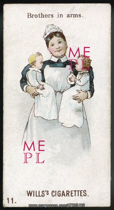 : NURSE HOLDS TWINS : NURSE HOLDS TWINS