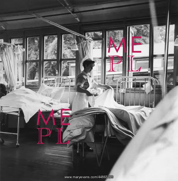 : NURSE MAKING A BED : NURSE MAKING A BED
