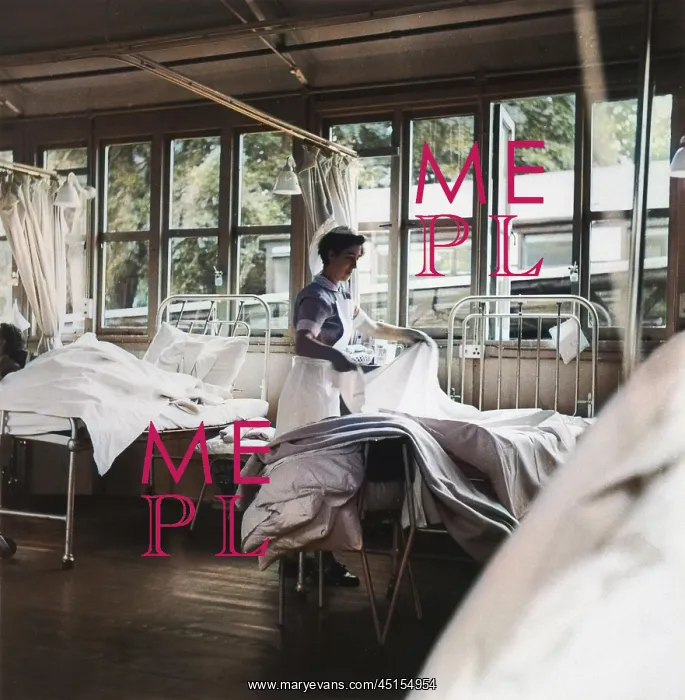 : NURSE MAKING A BED : NURSE MAKING A BED