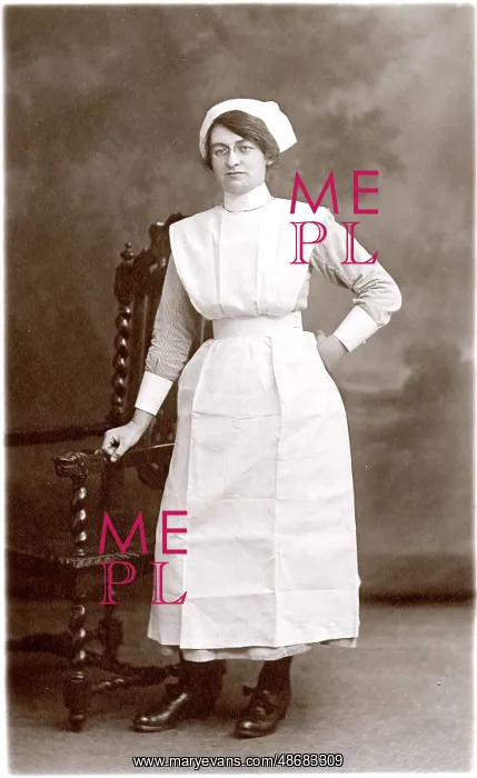 : Nurse Standing by Chair with Hand on hip : Nurse Standing by Chair with Hand on hip