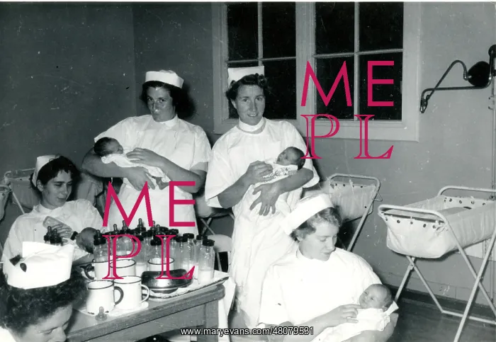 : Nurses with babies in hospital nursery : Nurses with babies in hospital nursery