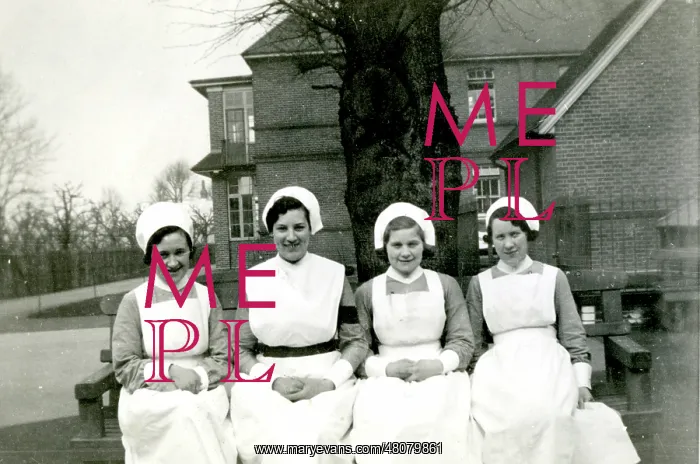 : Nurses on bench outside hospital : Nurses on bench outside hospital