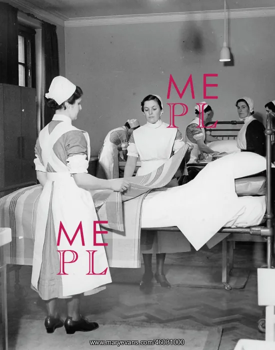 : Nurses making beds : Nurses making beds