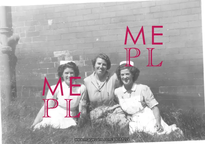 : Two nurses and woman in mufti : Two nurses and woman in mufti