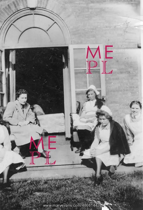 : Four nurses and woman in on steps : Four nurses and woman in on steps