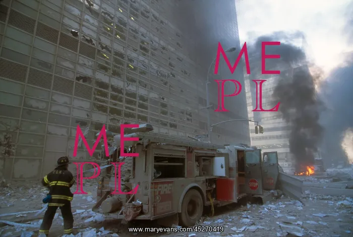 : NYC fireman pulling water hose from fire truck : NYC fireman pulling water hose from fire truck