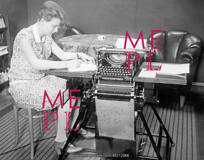 : Office worker with self-typing typewriter, 1923 : Office worker with self-typing typewriter, 1923