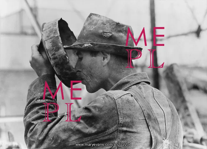 : Oil field worker drinking water from a crude ? : Oil field worker drinking water from a crude ?