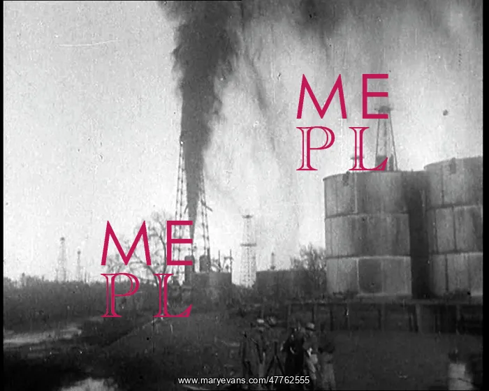 : Oil Gushing Out of a Spout in the Ground At : Oil Gushing Out of a Spout in the Ground At