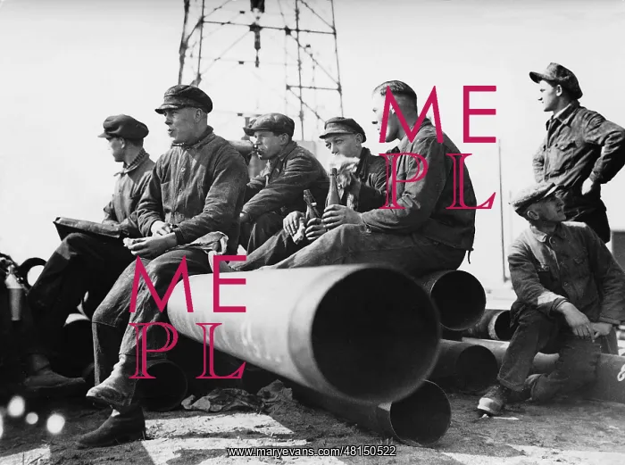 : Oil workers at the lunch break on casing pipes, 1934 : Oil workers at the lunch break on casing pipes, 1934