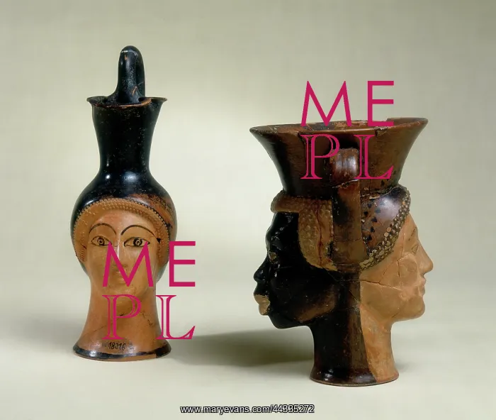 : An oinochoe in the shape : An oinochoe in the shape