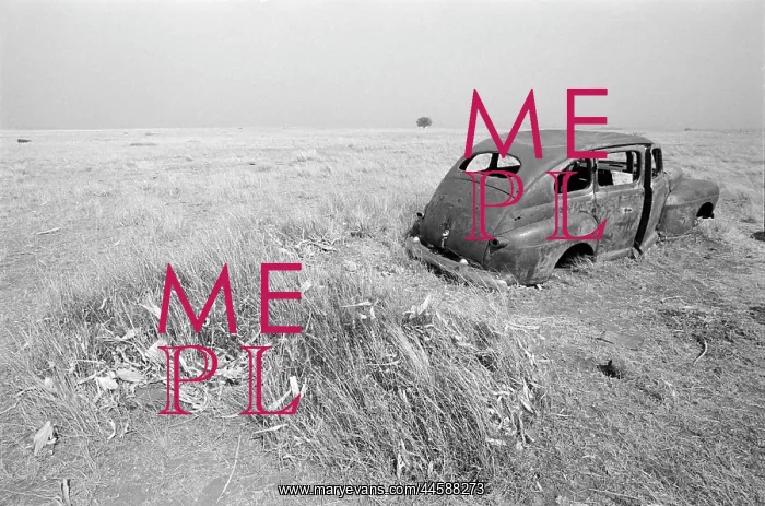 : Old car abandoned in a field during a drought in 1987 : Old car abandoned in a field during a drought in 1987