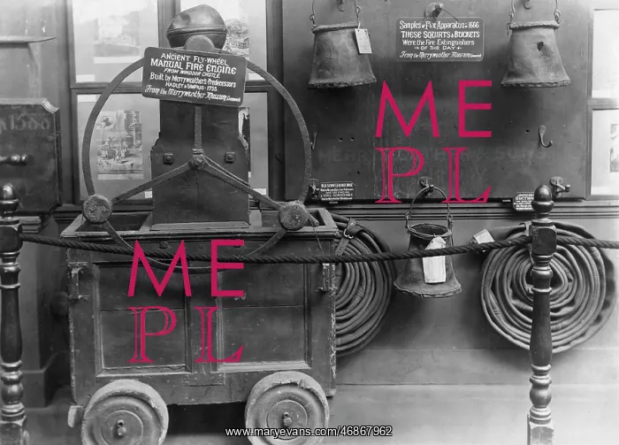 : Old fire engine and other equipment in a museum : Old fire engine and other equipment in a museum