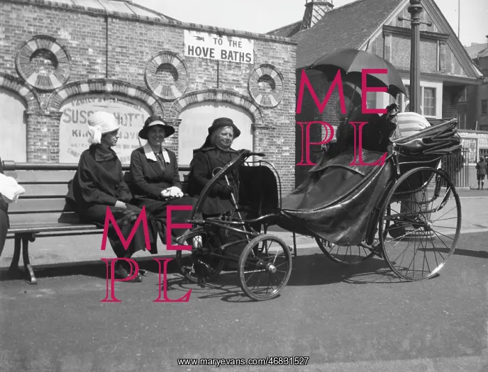 : Old lady in a bath chair : Old lady in a bath chair