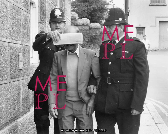 : Old Man arrested - face covered : Old Man arrested - face covered