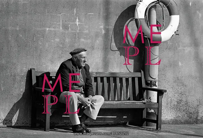 : An old man on a bench in the harbour at Ramsey, Isle of Man : An old man on a bench in the harbour at Ramsey, Isle of Man