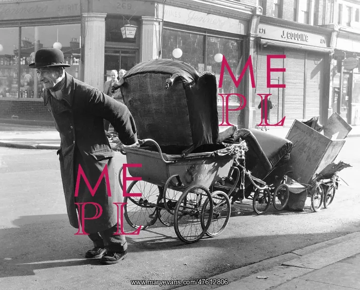 : Old man pulling prams, Balham, SW London : Old man pulling prams, Balham, SW London