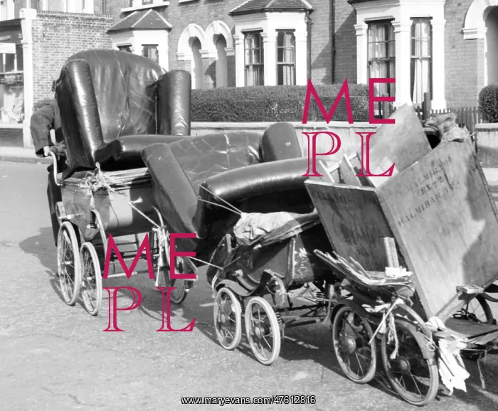 : Old man pulling prams, Balham, SW London : Old man pulling prams, Balham, SW London