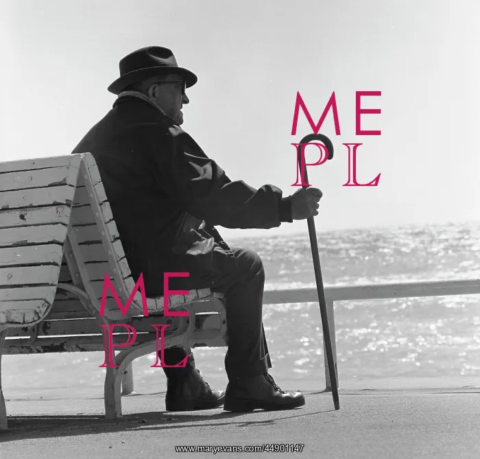 : Old man sitting on a bench looking out to sea : Old man sitting on a bench looking out to sea