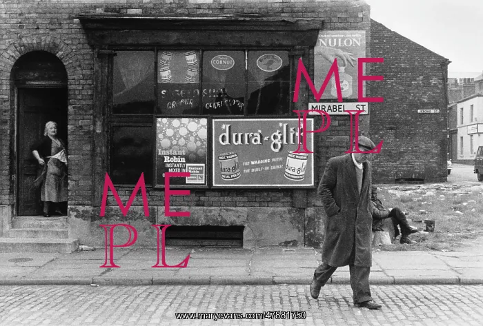 : Old man walking away from Grocers Shop : Old man walking away from Grocers Shop