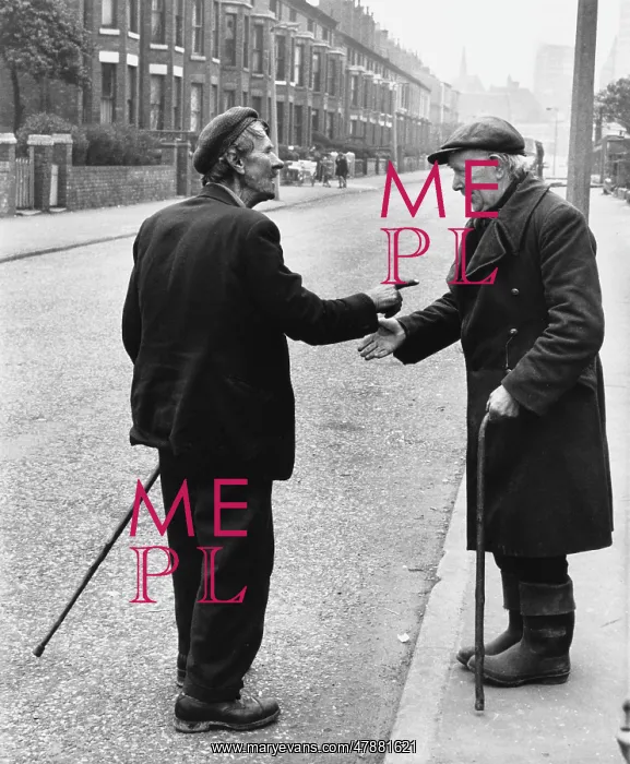 : Two old men chat on a Manchester street : Two old men chat on a Manchester street