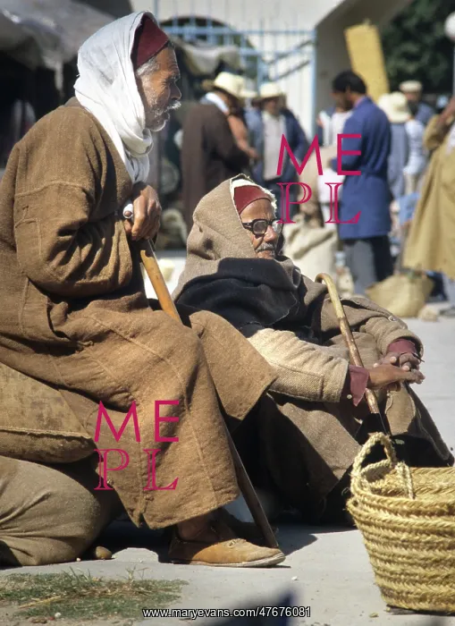 : Two old men with djellebas and chechia hats : Two old men with djellebas and chechia hats