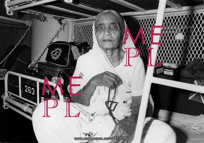 : This old woman is puzzled but resigned. She is : This old woman is puzzled but resigned. She is