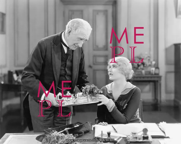 : Older man serving a woman tea on a tray : Older man serving a woman tea on a tray