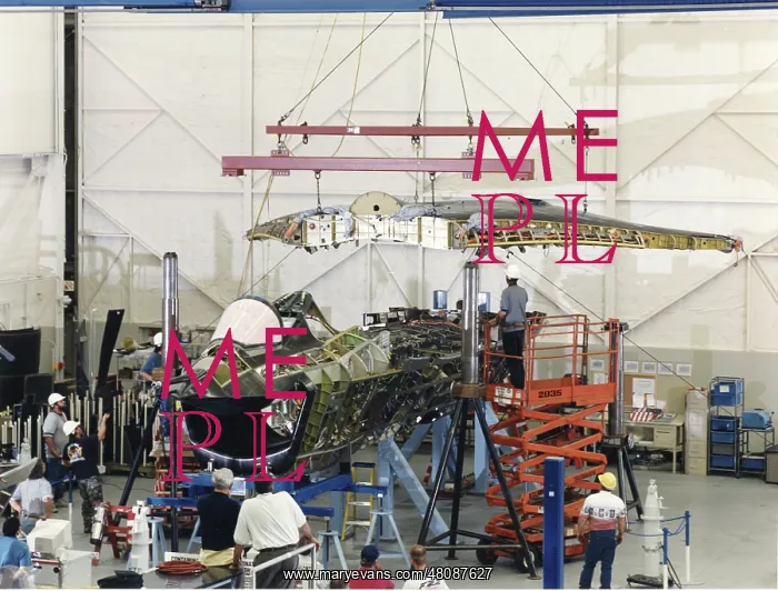 : The one-piece wing is lowered into place on the Boing X? : The one-piece wing is lowered into place on the Boing X?