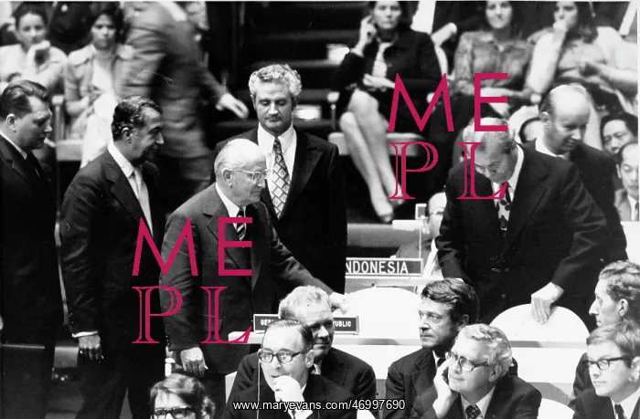: Otto Winzer taking his seat at a meeting : Otto Winzer taking his seat at a meeting
