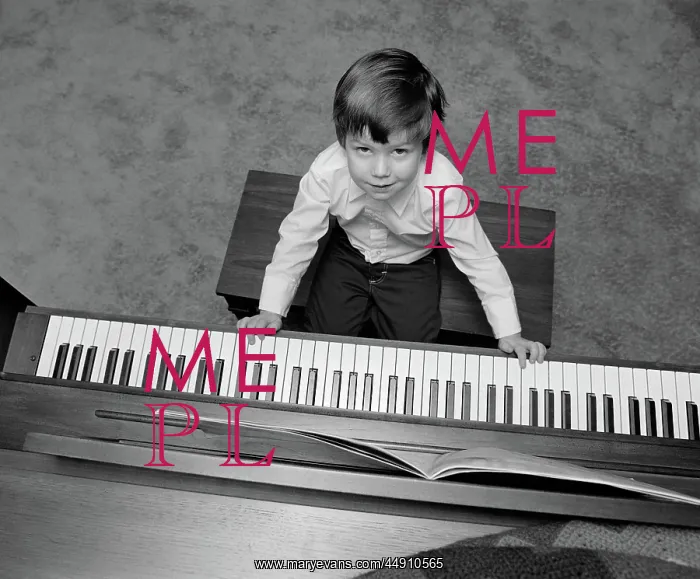 : Overhead of boy sitting on bench with fingers : Overhead of boy sitting on bench with fingers