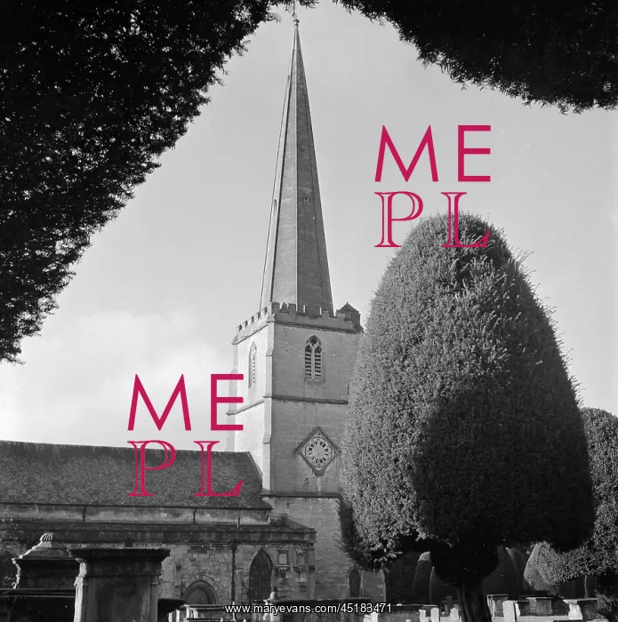 : Painswick. A view across a churchyard to the 15th century tower : Painswick. A view across a churchyard to the 15th century tower