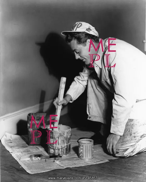 : Painter. Man painter in whites mixes paint on the floor : Painter. Man painter in whites mixes paint on the floor