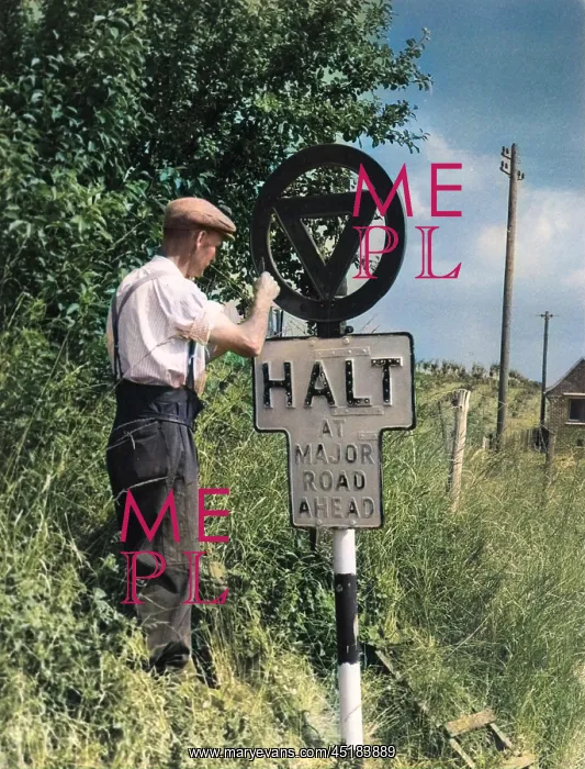 : PAINTING A ROAD SIGN : PAINTING A ROAD SIGN