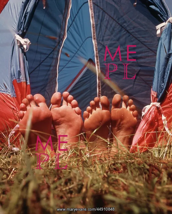: Two Pair Bare Feet Sticking Out Tent Grass : Two Pair Bare Feet Sticking Out Tent Grass