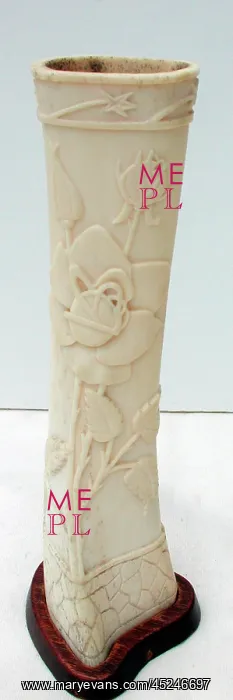 : Pair of carved bone ornaments with raised foliate decoration : Pair of carved bone ornaments with raised foliate decoration