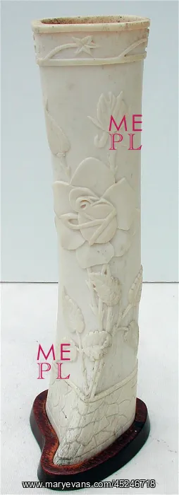 : Pair of carved bone ornaments with raised foliate decoration : Pair of carved bone ornaments with raised foliate decoration