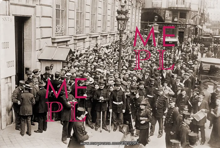 : Paris police hold back a crowd making a ? : Paris police hold back a crowd making a ?