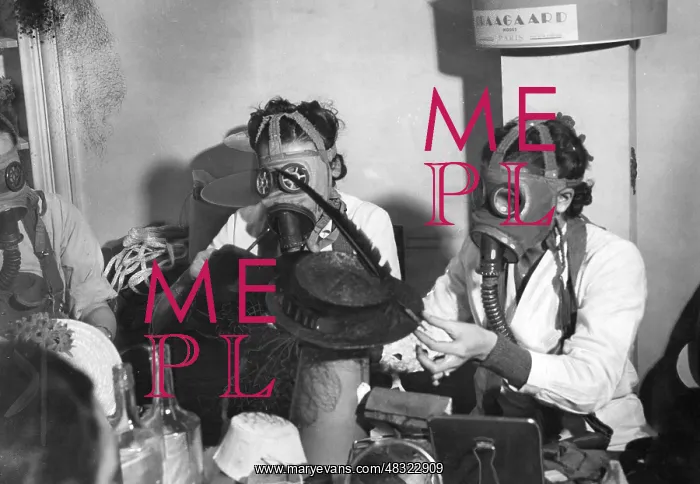 : Parisian milliners work while wearing breathing masks, 1939 : Parisian milliners work while wearing breathing masks, 1939