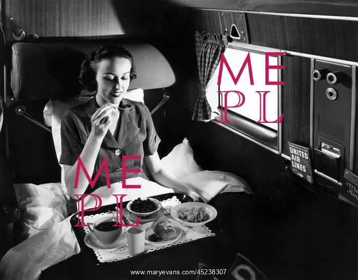 : A passenger eats breakfast on United Airline's ? : A passenger eats breakfast on United Airline's ?