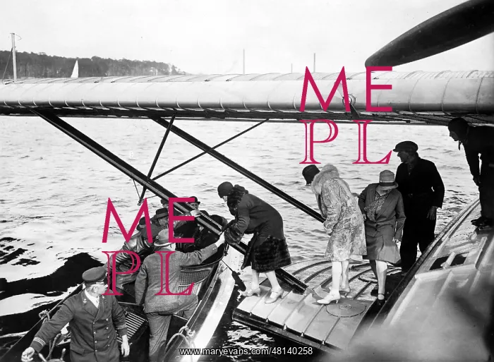 : Passengers leave a Superwal flying boat : Passengers leave a Superwal flying boat