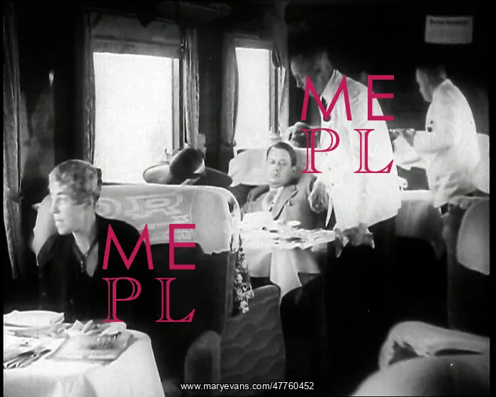 : Passengers Sitting in the Dining Car of a Train : Passengers Sitting in the Dining Car of a Train