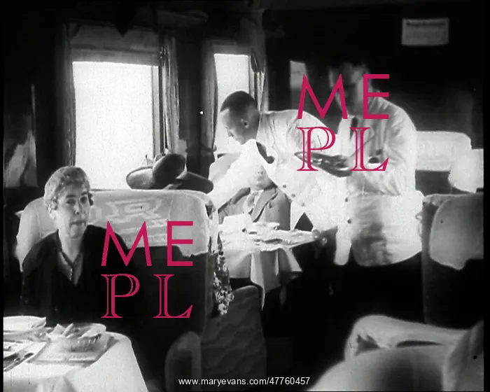 : Passengers Sitting in the Dining Car of a Train : Passengers Sitting in the Dining Car of a Train