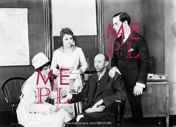 : Patient and two nurses attending him and a friend : Patient and two nurses attending him and a friend