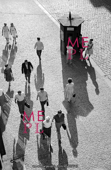 : Pedestrians - shadows - cobble stone - phone booth : Pedestrians - shadows - cobble stone - phone booth