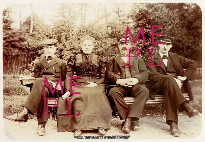 : Four people on a bench in a garden : Four people on a bench in a garden