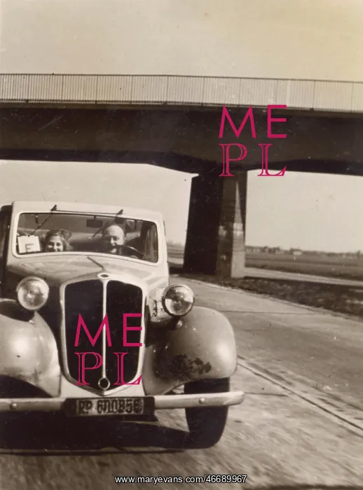 : Two people in a car on the Autobahn, Germany : Two people in a car on the Autobahn, Germany