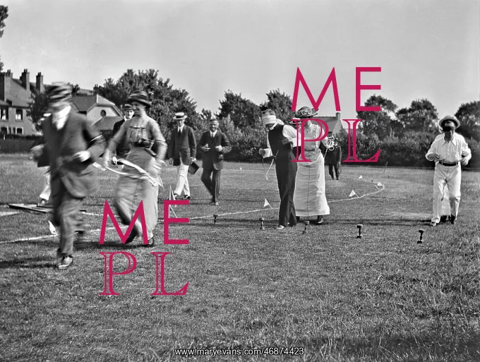 : People at a comic sports event in a field : People at a comic sports event in a field
