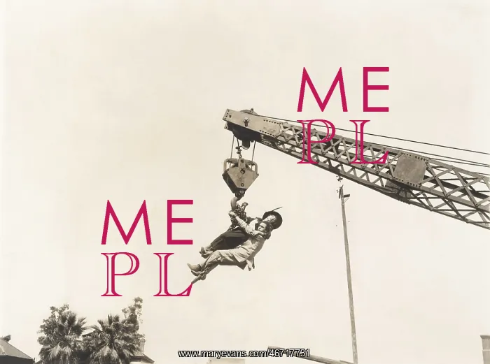 : Two people dangling from crane : Two people dangling from crane