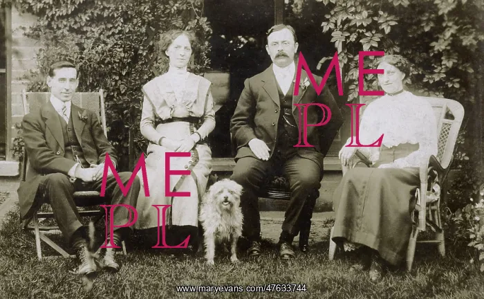  : Four people and a dog in a garden